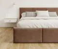 Čalúnená posteľ AMBER 180x200 Hnedá Trinity s úložným priestorom a dreveným roštom