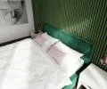 Čalúnená posteľ CARO 140x200 s kovovým zdvižným roštom ZELENA