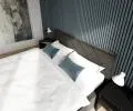 Čalúnená posteľ CARO 160x200 s kovovým zdvižným roštom ČIERNA