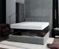 Čalúnená posteľ JUSTIN 180x200 Sivá Trinity s úložným priestorom kovový rošt