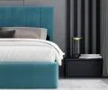 Čalúnená posteľ JUSTIN 120x200 Tyrkysová Trinity s úložným priestorom kovový rošt