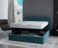 Čalúnená posteľ JUSTIN 180x200 Tyrkysová Trinity s úložným priestorom kovový rošt